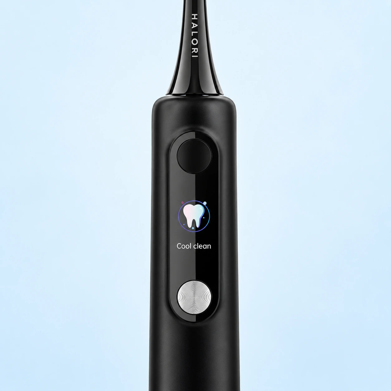 Close-up of the Halori toothbrush colour screen and silver control button